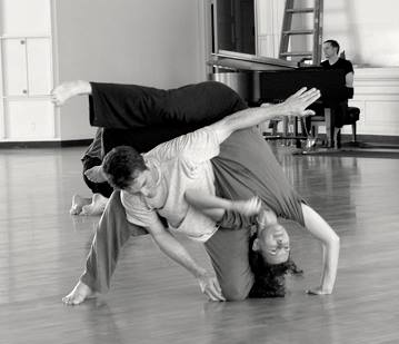 Image: Author, Poet, Dancer, and Teacher Cheryl Pallant. Cheryl is participating in a contact improvisation dance exercise with a male partner. 