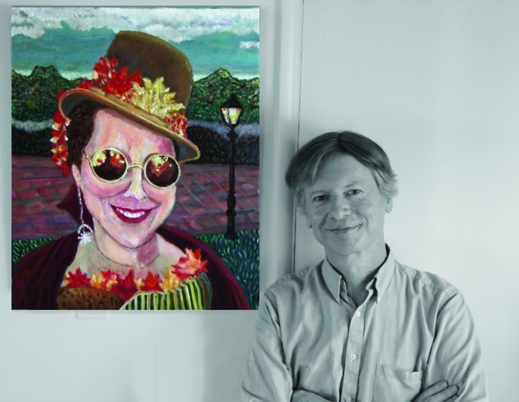Author and artist Max Talley poses in front of a painting of a woman to his left.